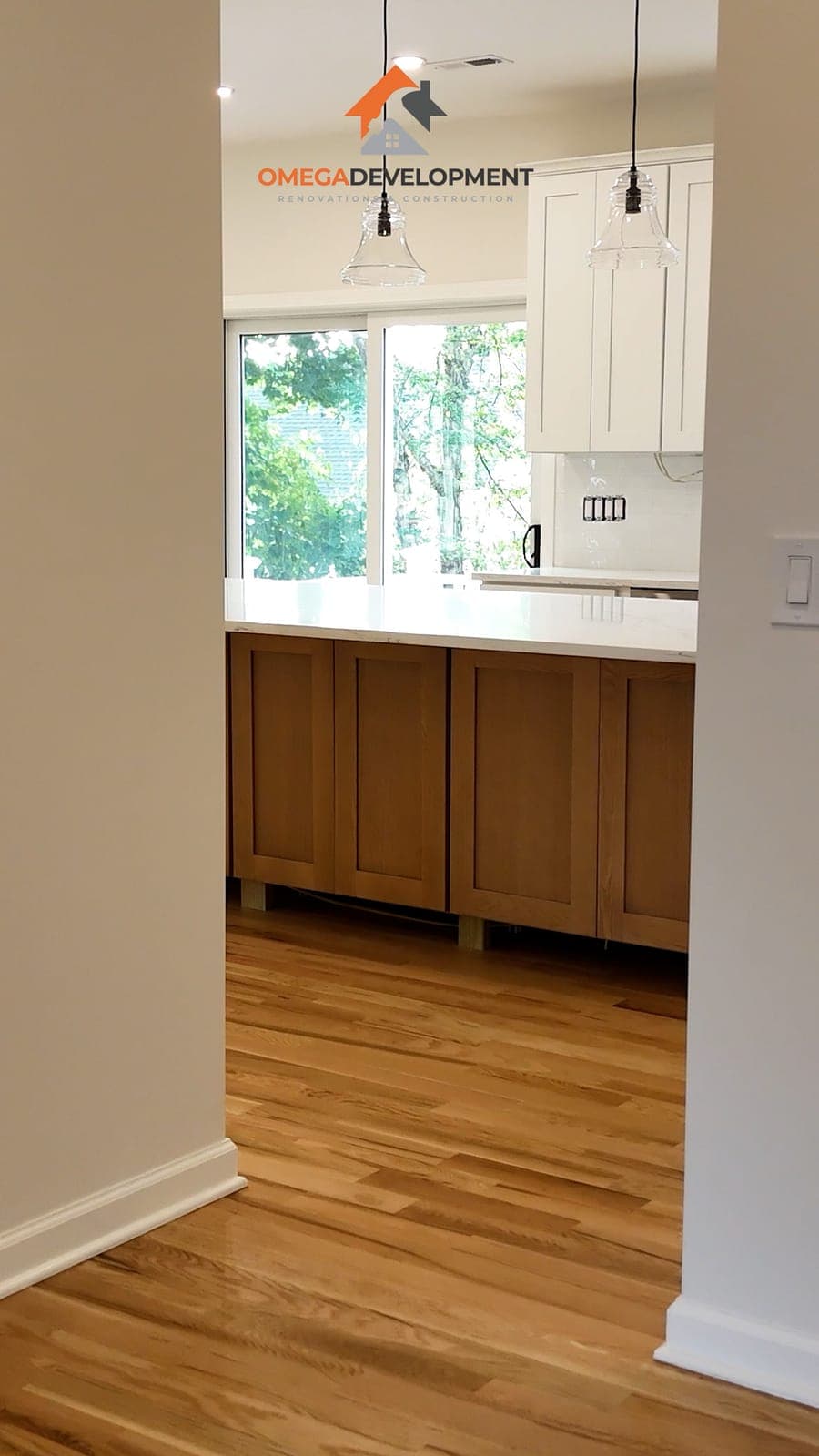 Open-Concept Kitchen — bathroom remodel by Omega Development