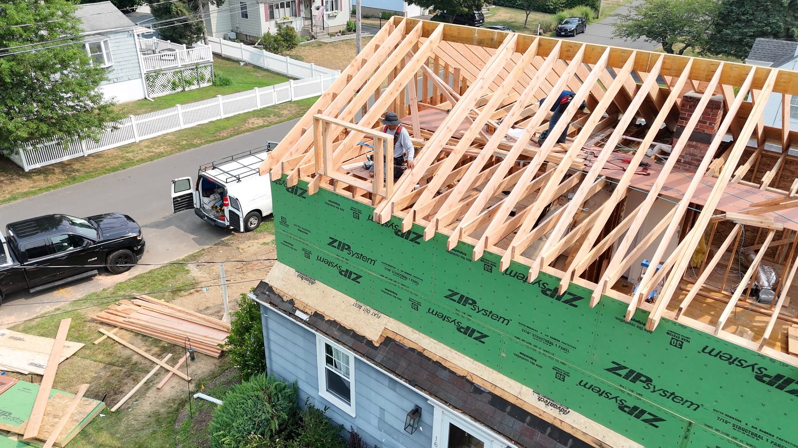 Second-floor walls framed on top of the existing house
