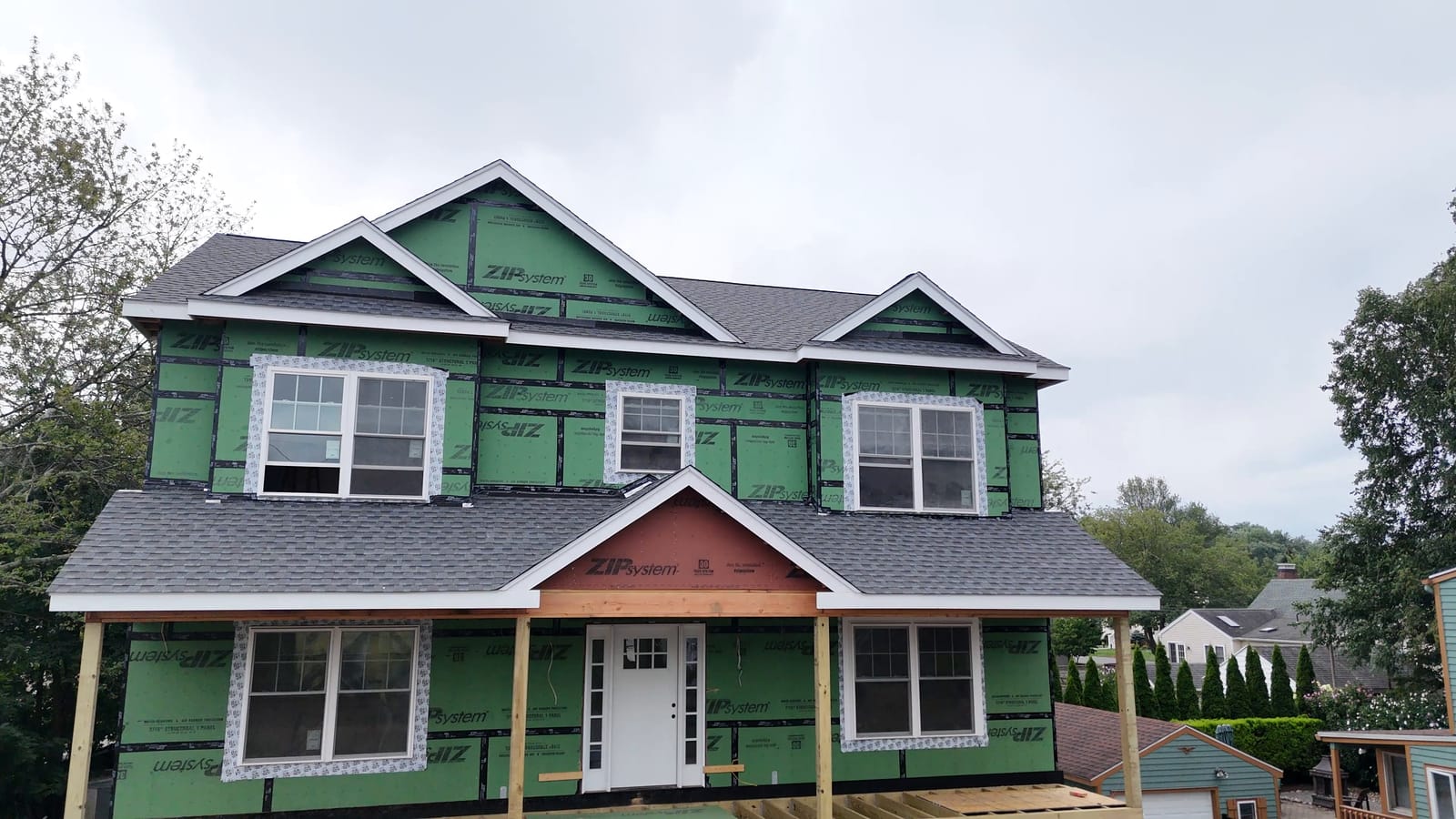 New second story sheathed with ZIP panels and windows in