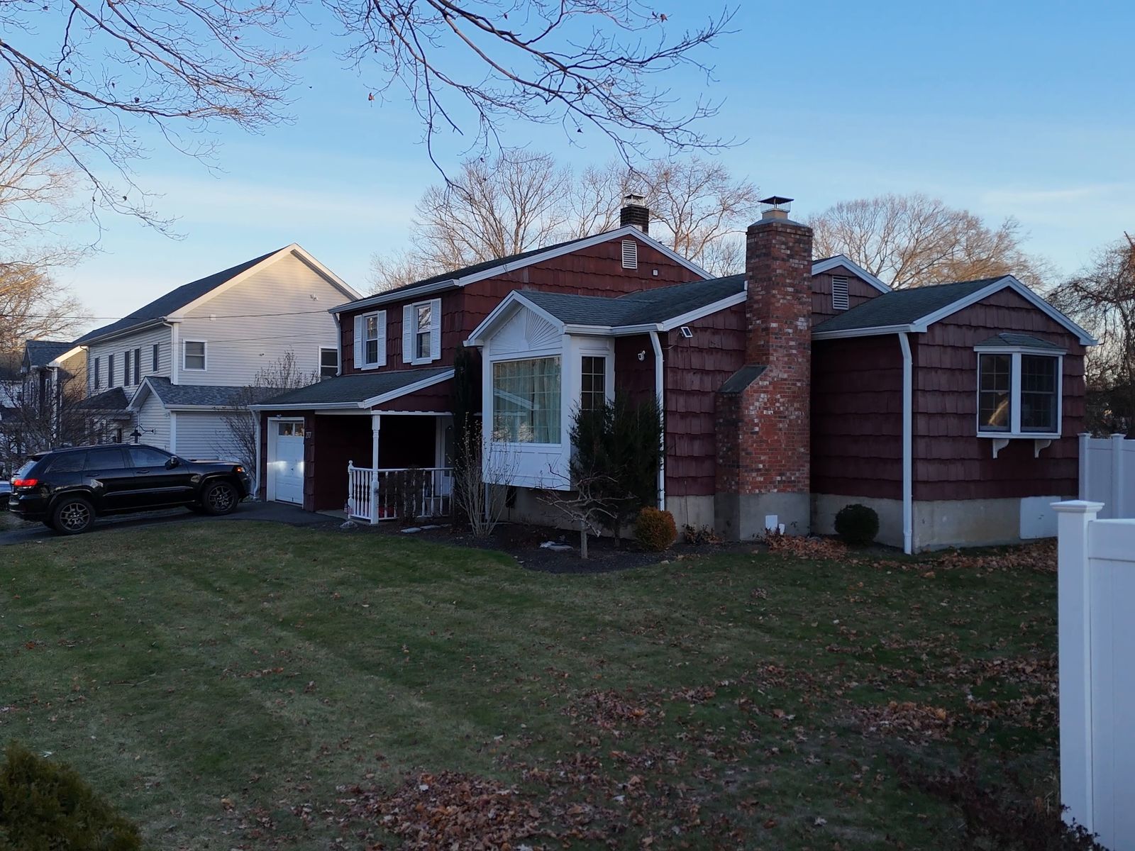 Before: the house with its original red shingle siding