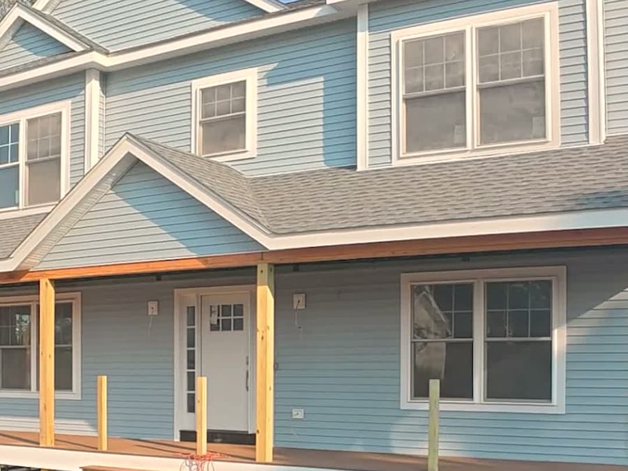 Complete — Finished siding and trim.