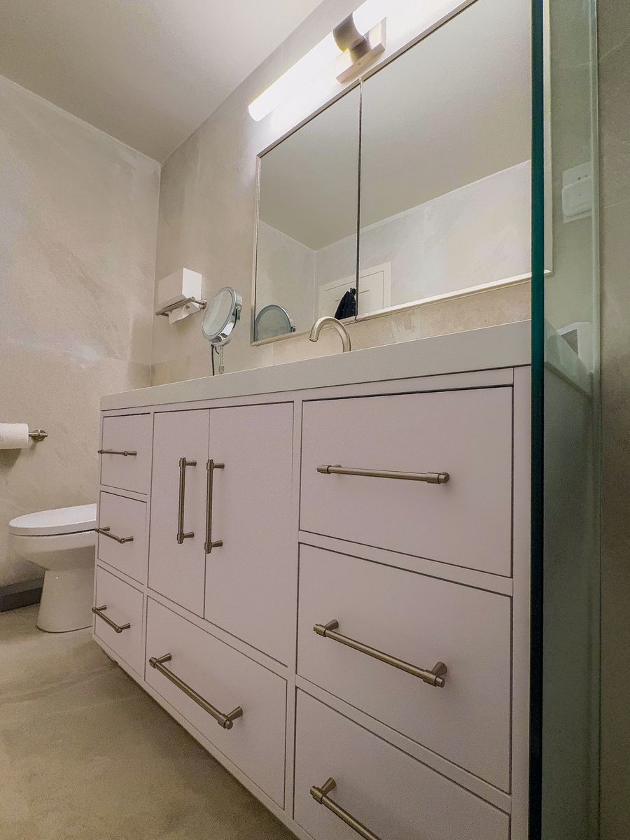 Vanity, medicine cabinet, and walk-in shower in a remodeled Stamford bathroom